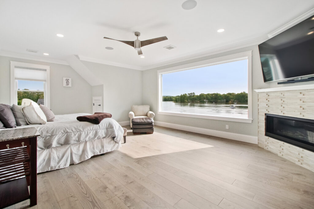 Modern bedroom with a view of a water